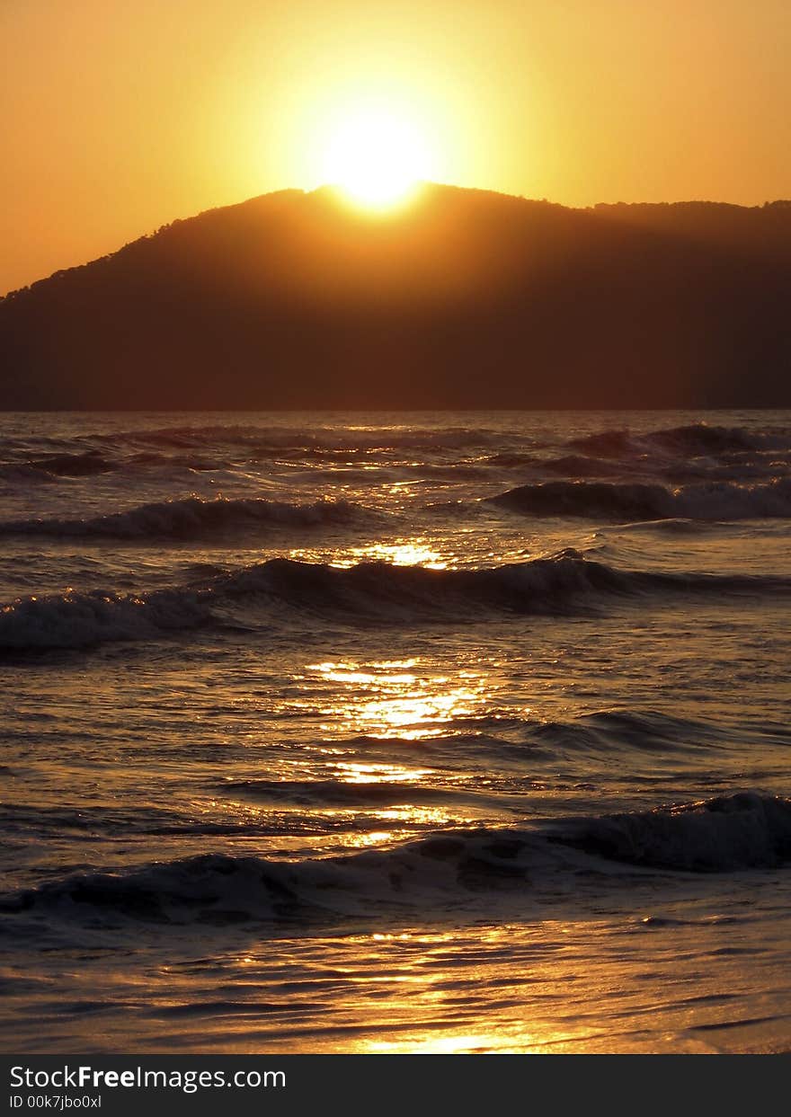 Sunset on the sea with sun reflection