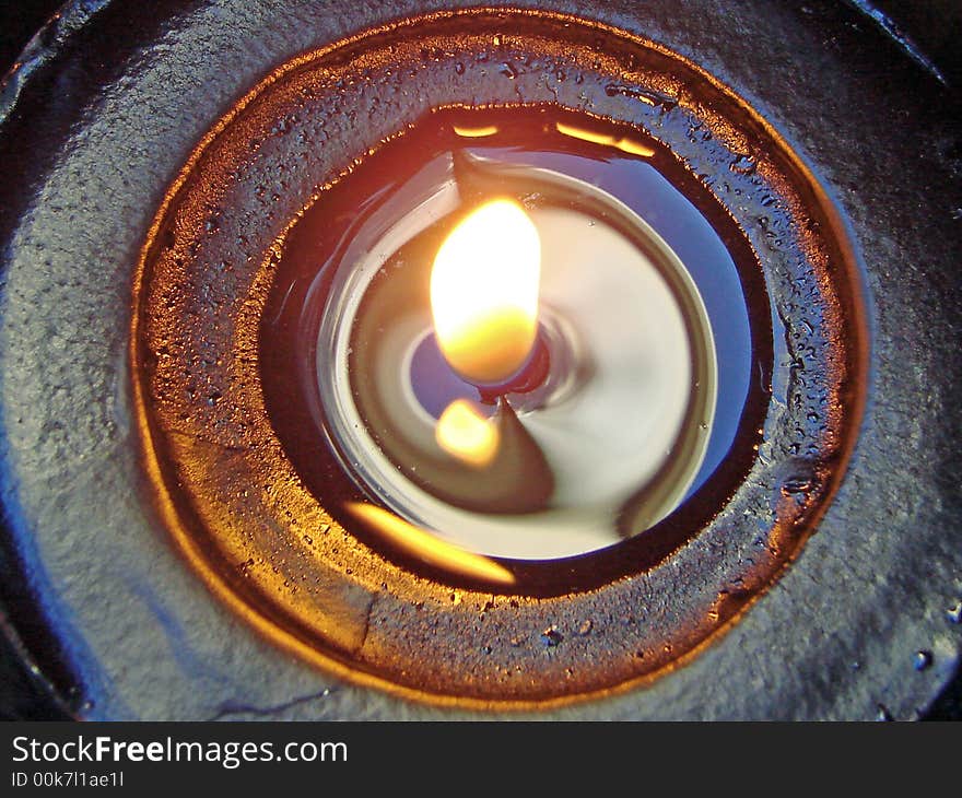 A close-up of a lit candle. A close-up of a lit candle