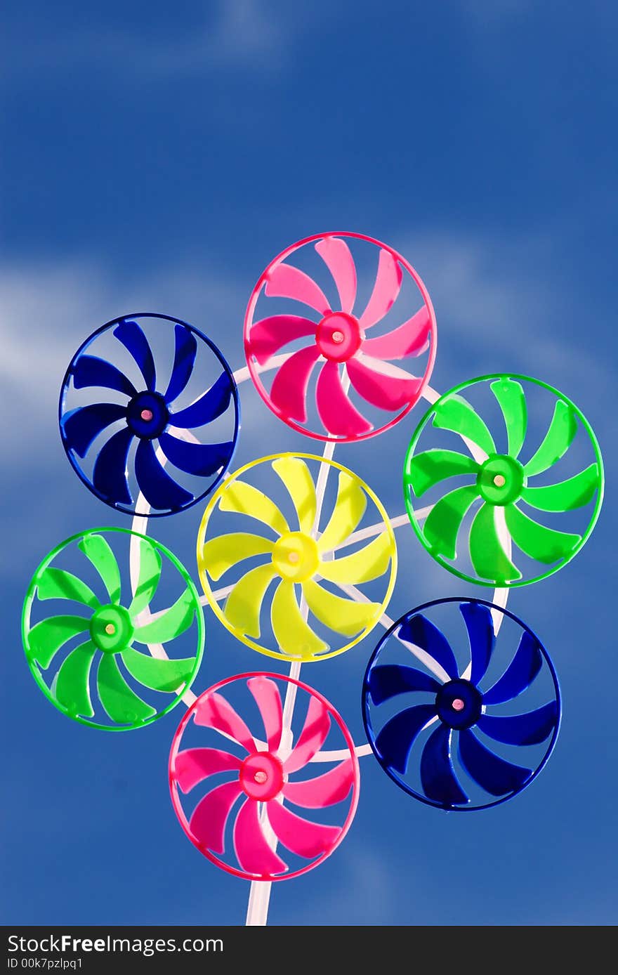 Spinner toy on the blue skies background