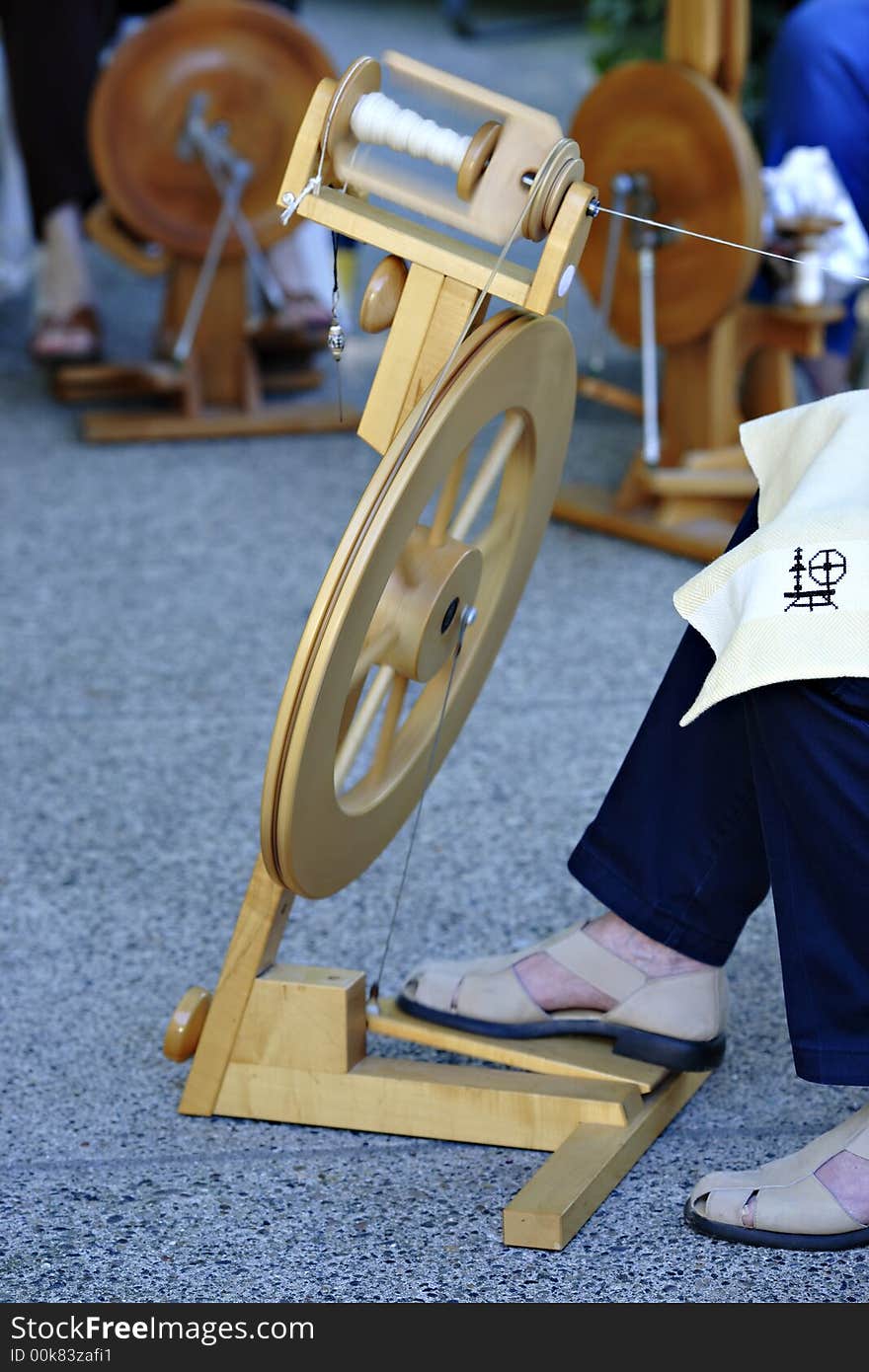 Spinning thread and wool with foot