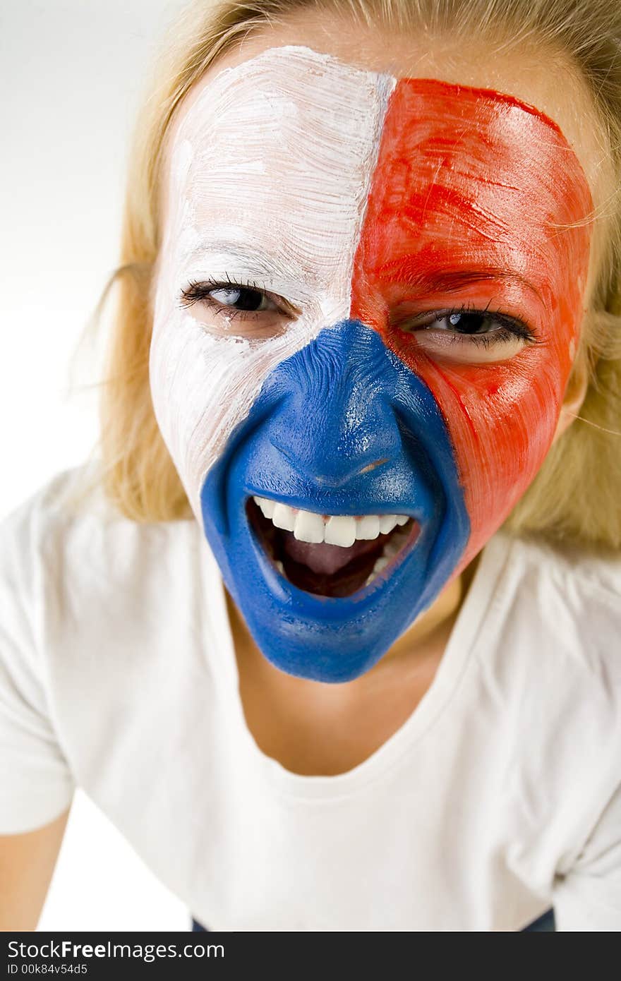 Young screaming Czechish sport's fan with painted flag on face. Front view. She's looking at camera. Closeup on face. Young screaming Czechish sport's fan with painted flag on face. Front view. She's looking at camera. Closeup on face.