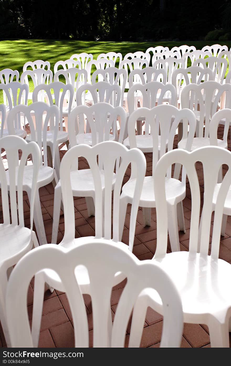 White aisle chairs at a wedding. White aisle chairs at a wedding