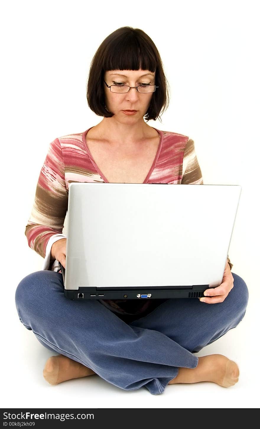 Woman works at computer in relaxed situation. Woman works at computer in relaxed situation