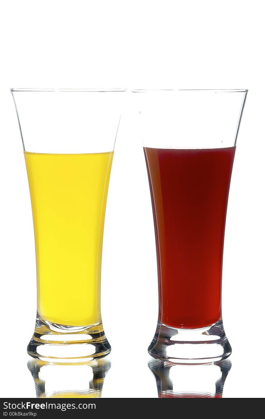 Glasses with juice on the white background