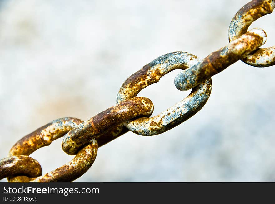 Rusty chain links on a light background