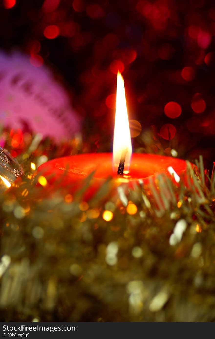 Christmas theme. Candle and ornaments.