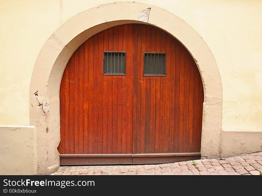 Rustic European Door with arch and cobblestone street. Rustic European Door with arch and cobblestone street