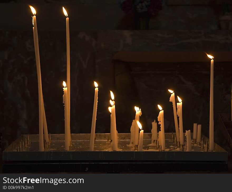 Burning candles in a christian church