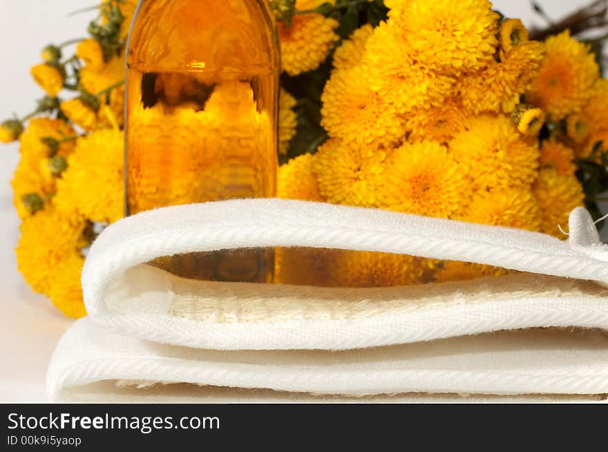 An image of oil and yellow flowers. An image of oil and yellow flowers