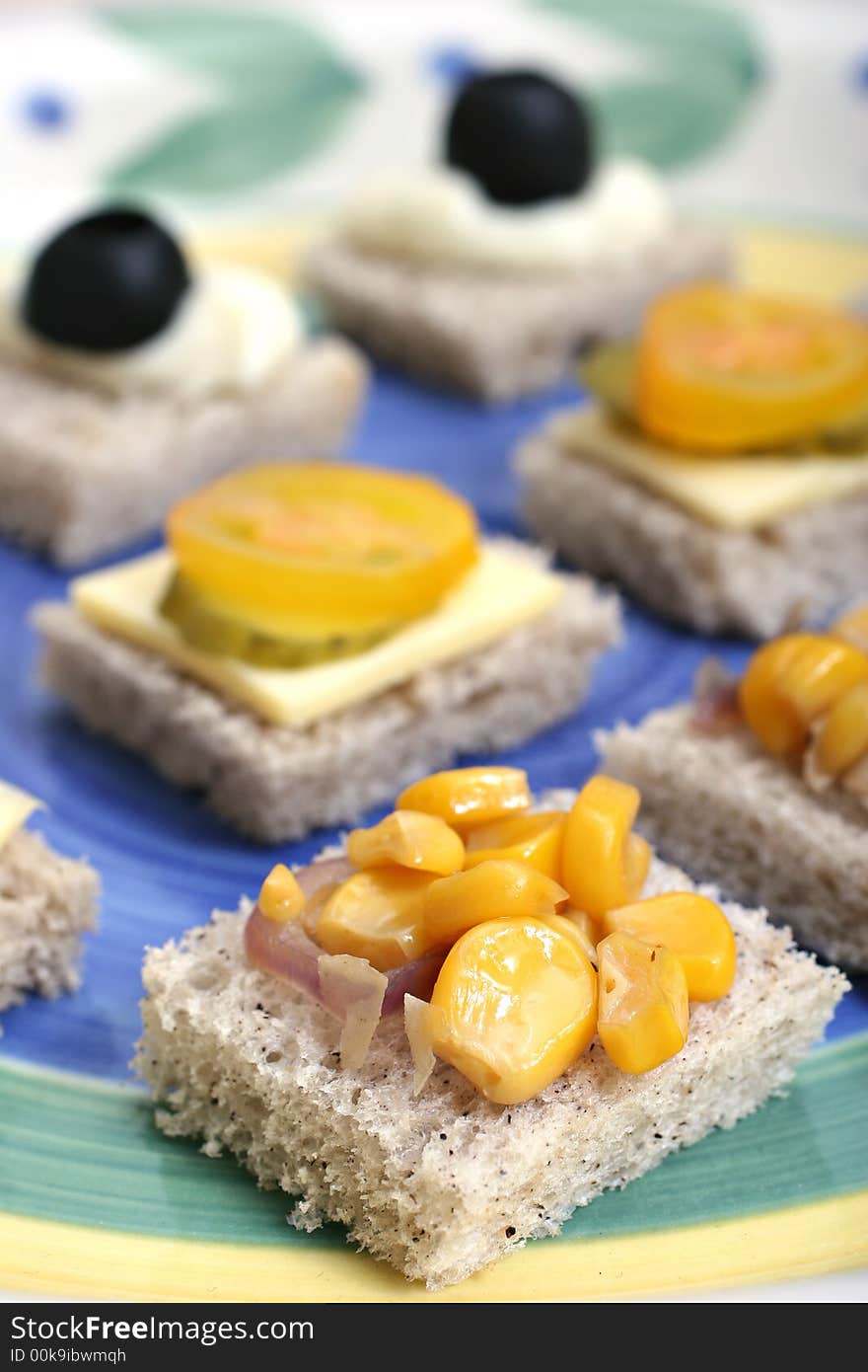 Fruit and vegetable canapes on a white ceramic plate