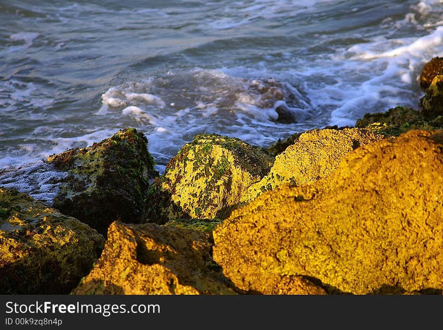 Close up of water (sea) & beack stones