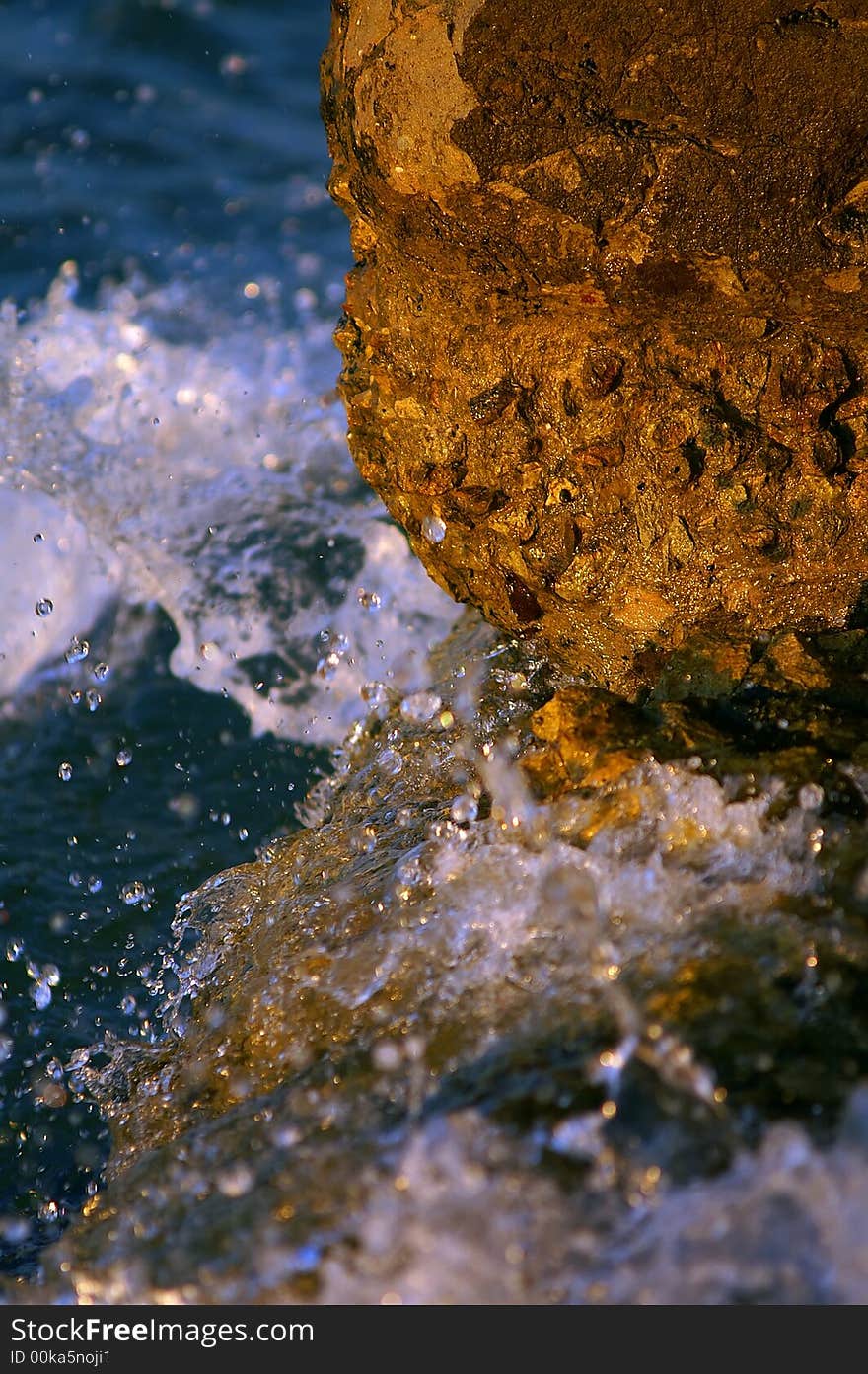 Splashing of sea waves on beach stones. Splashing of sea waves on beach stones