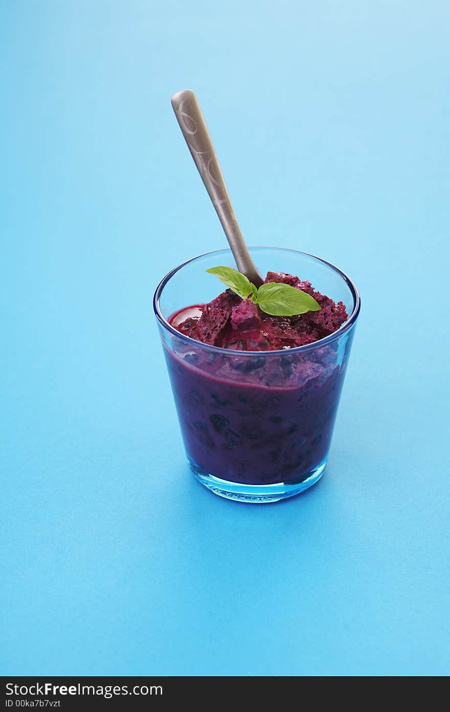 Glass of home made bilberry yogurt with bread crumbs