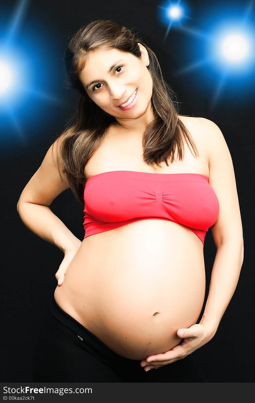 Pregnant woman with the hand in the womb. Pregnant woman with the hand in the womb.