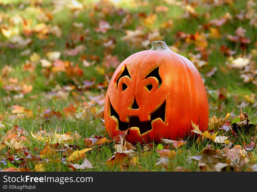 Lone carved pumpkin at the pumpkin patch. Lone carved pumpkin at the pumpkin patch