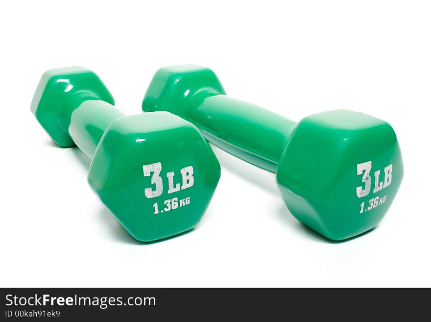 Green dumbbells isolated on white background