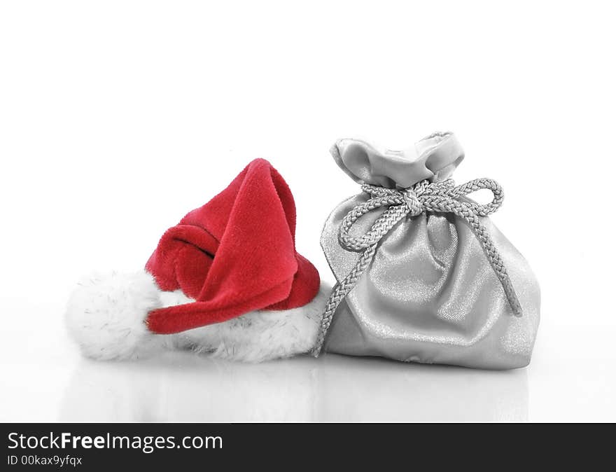 Silver gift bag with red santa claus hat. Silver gift bag with red santa claus hat