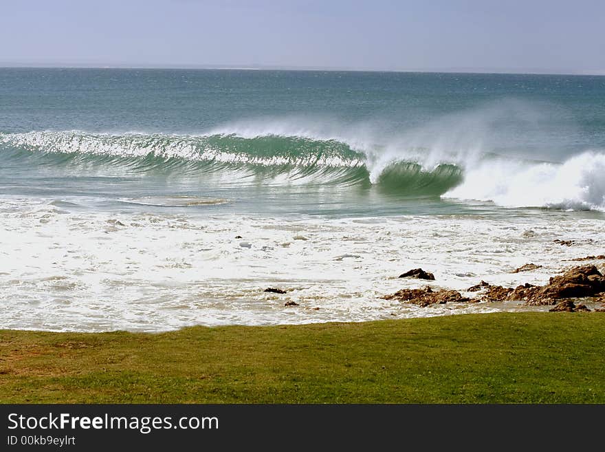 Water spray blown by strong winds and high tide. Water spray blown by strong winds and high tide