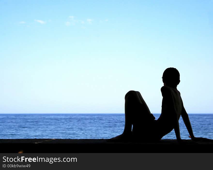 Silhouette Of Boy And Sea