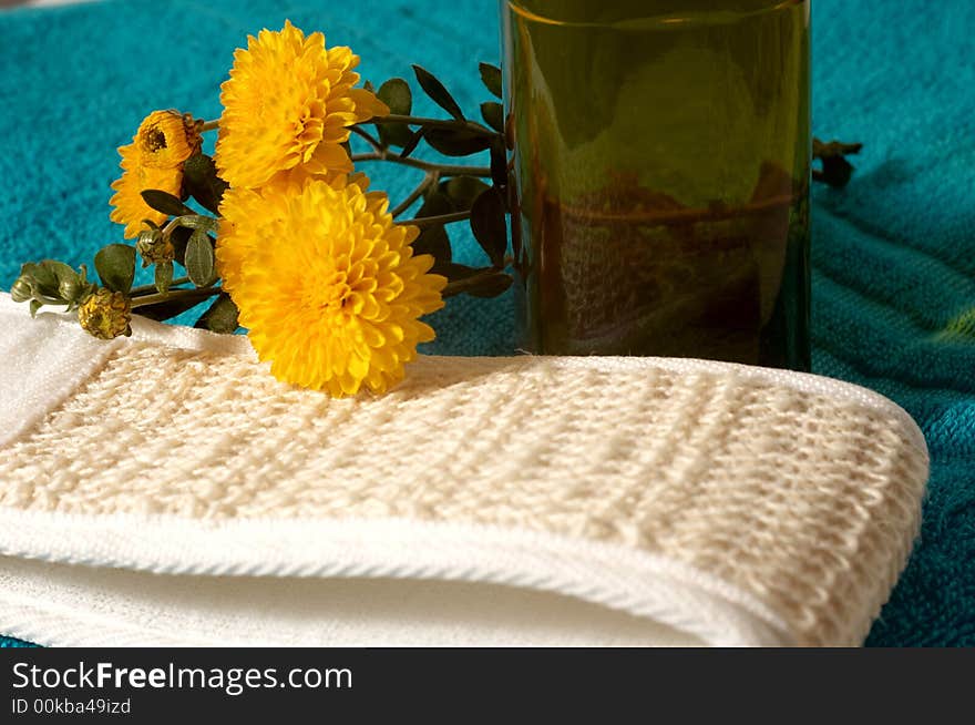 An image of sponge and flowers in bathroom. An image of sponge and flowers in bathroom