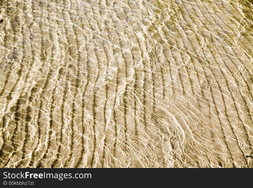 Sandy bottom of crystal clear lake - perfect background