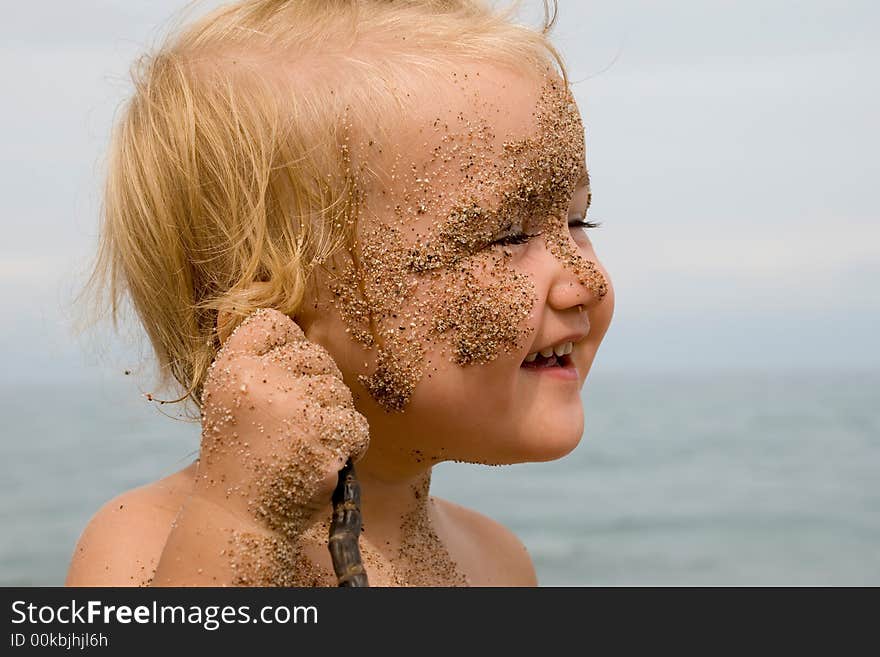 Portrait of baby playing on the beach. Portrait of baby playing on the beach