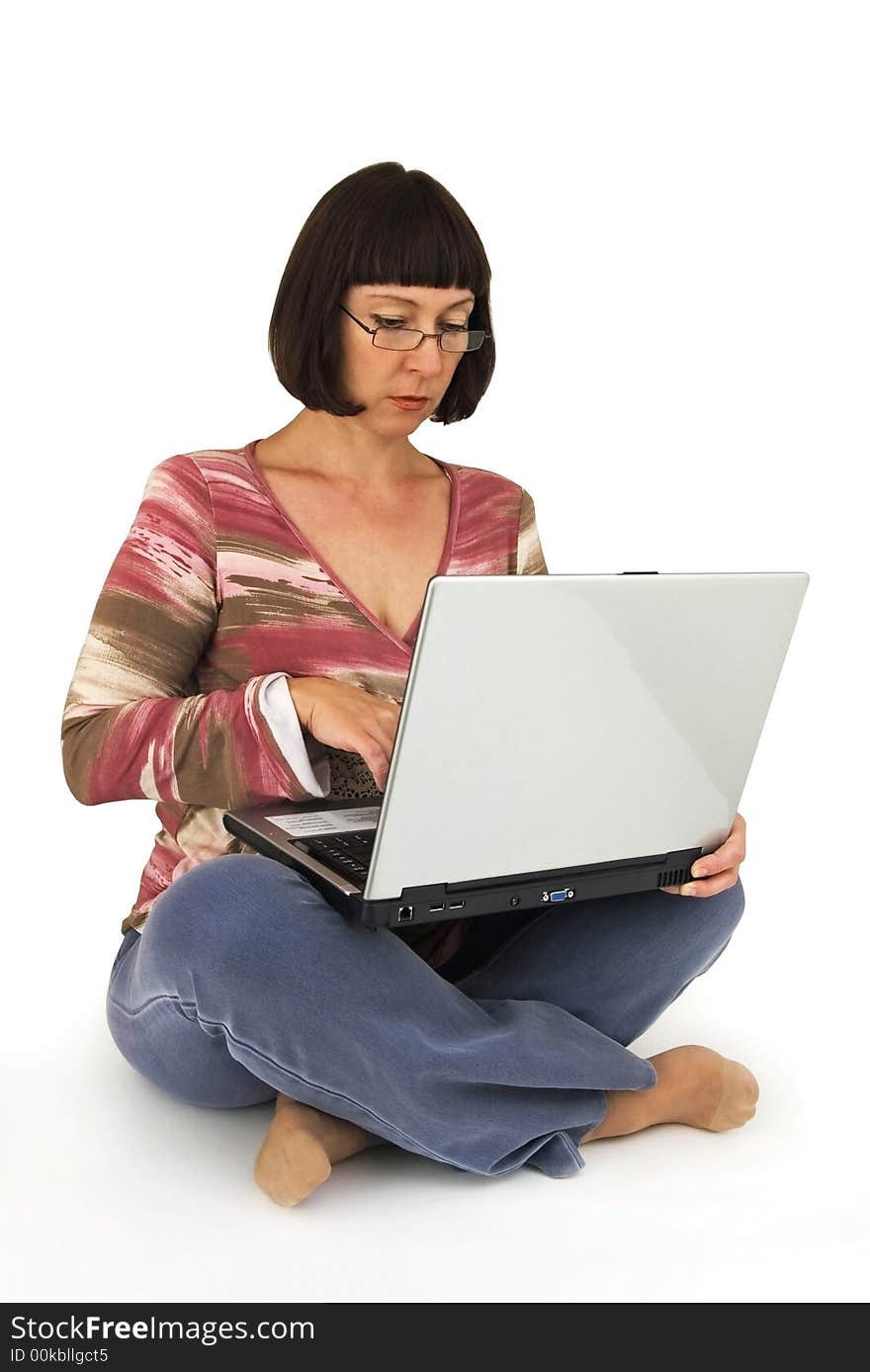 Woman works at computer in relaxed situation. Woman works at computer in relaxed situation