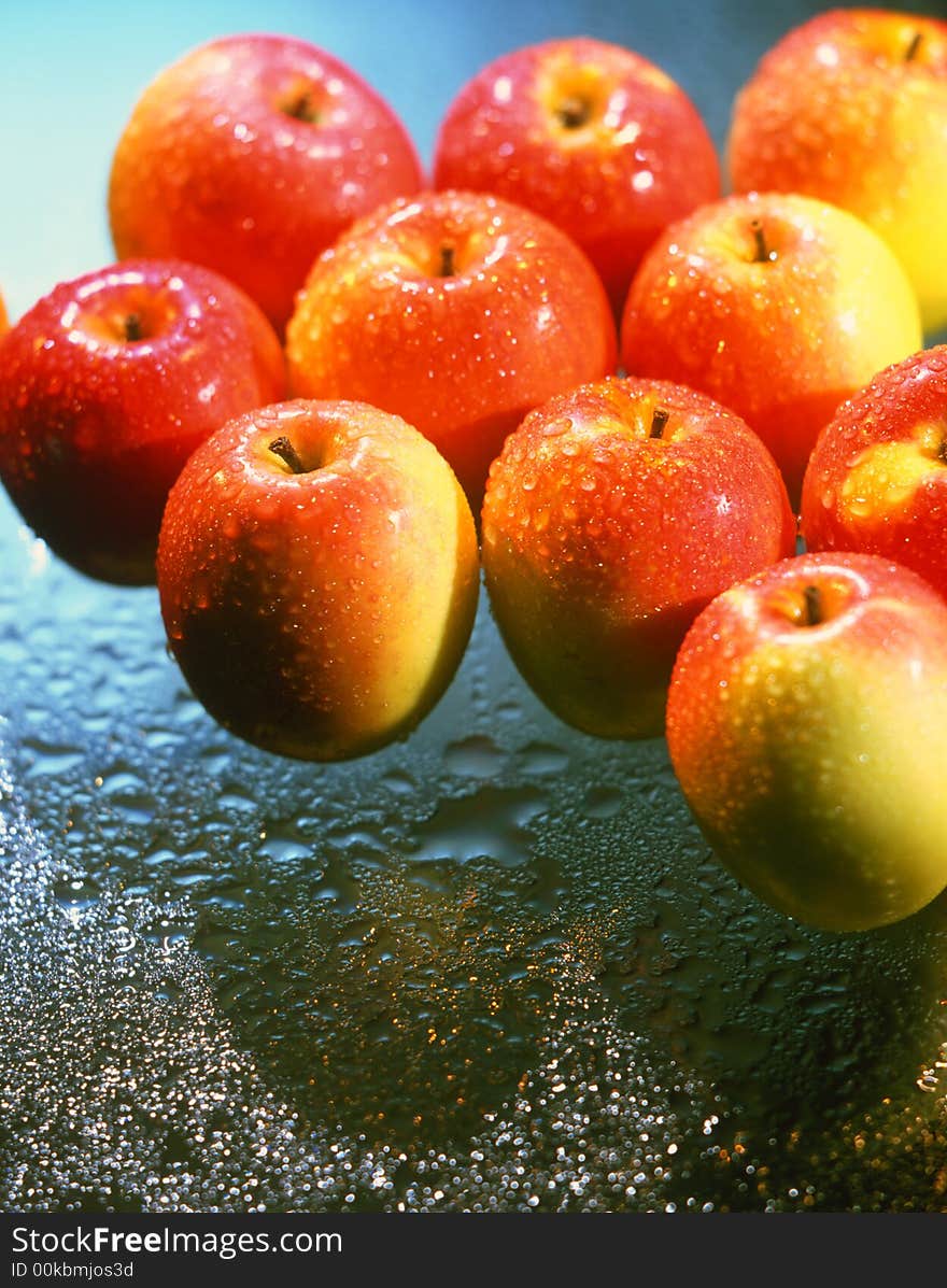 Red apples on a blue background