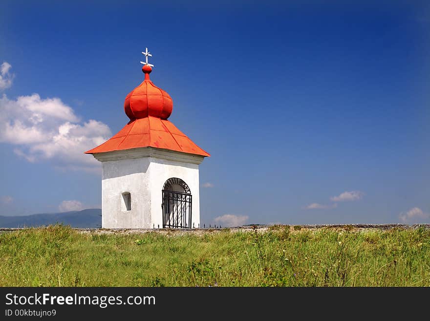 Rustic Christian chapel with red roof. Rustic Christian chapel with red roof