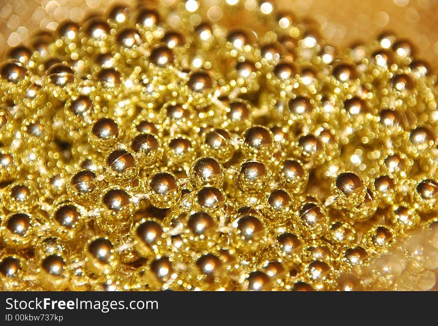 Golden beads; could be used in backgrounds. Golden beads; could be used in backgrounds