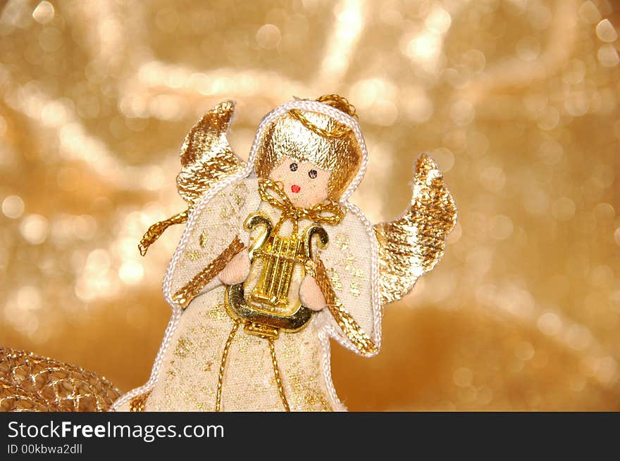 Christmas angel toy with golden decoration