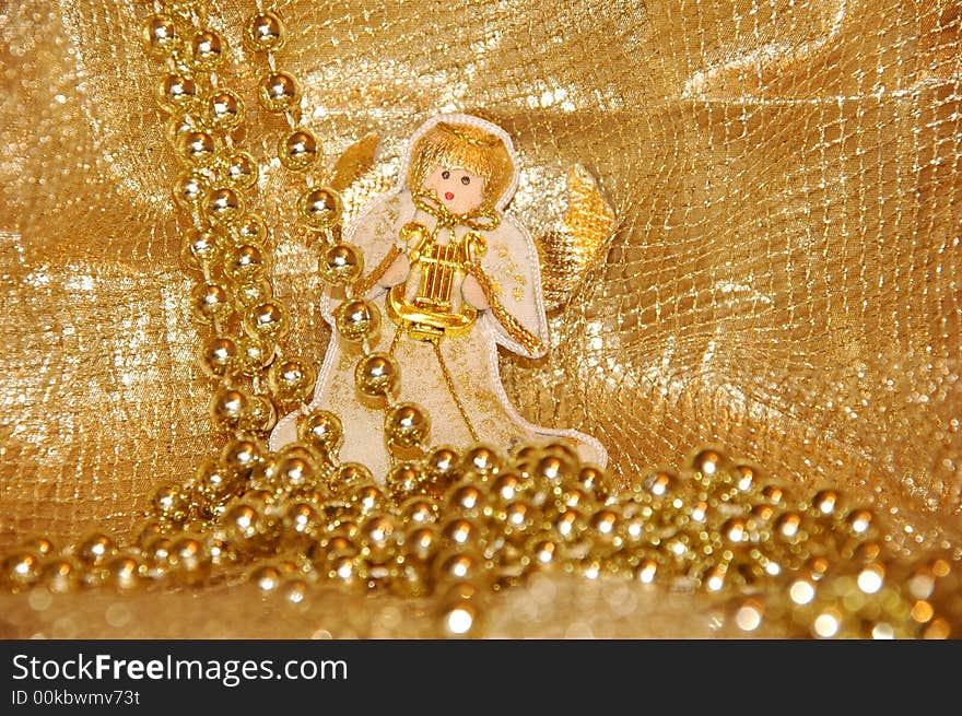 Christmas angel toy with golden decoration