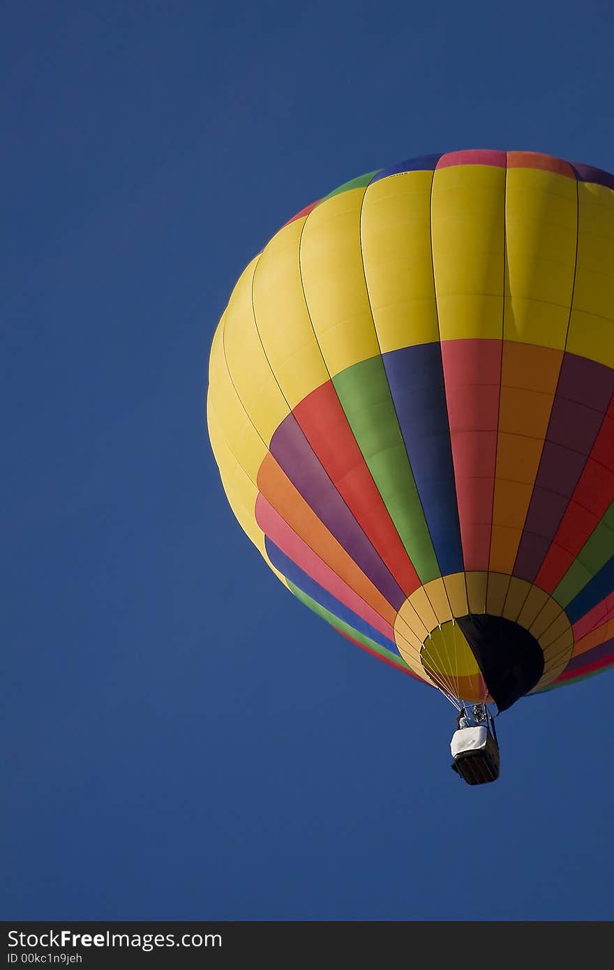 Colorful hot air balloon in deep blue sky