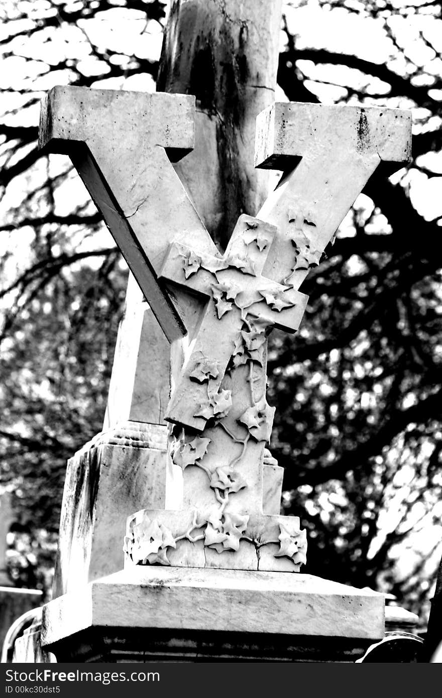 This is a black and white view of a Y with a Cross and ivy/vines at the Laurel Hill Cemetary.  I go there at least once a year with a bunch of goth mommies and daddies and their children on the Kinderbats picnic. This is a black and white view of a Y with a Cross and ivy/vines at the Laurel Hill Cemetary.  I go there at least once a year with a bunch of goth mommies and daddies and their children on the Kinderbats picnic..