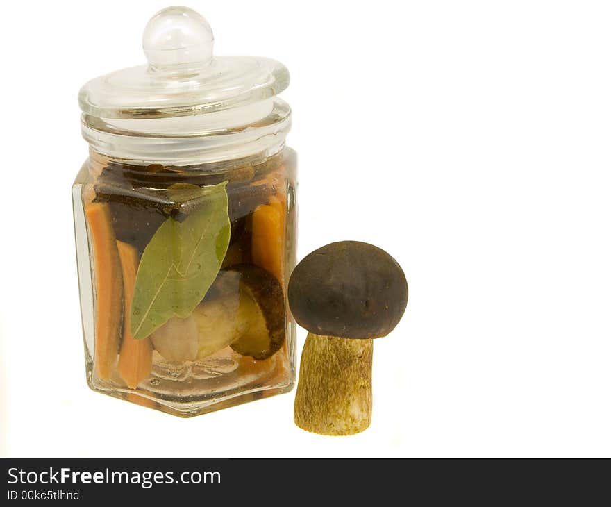 Mushroom in the jar on a white background