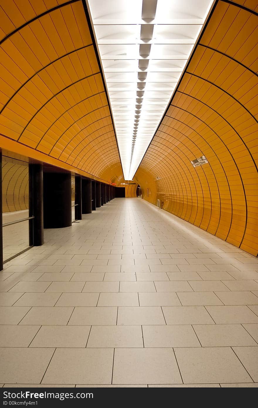 An underground metro access tunnel in orange. An underground metro access tunnel in orange