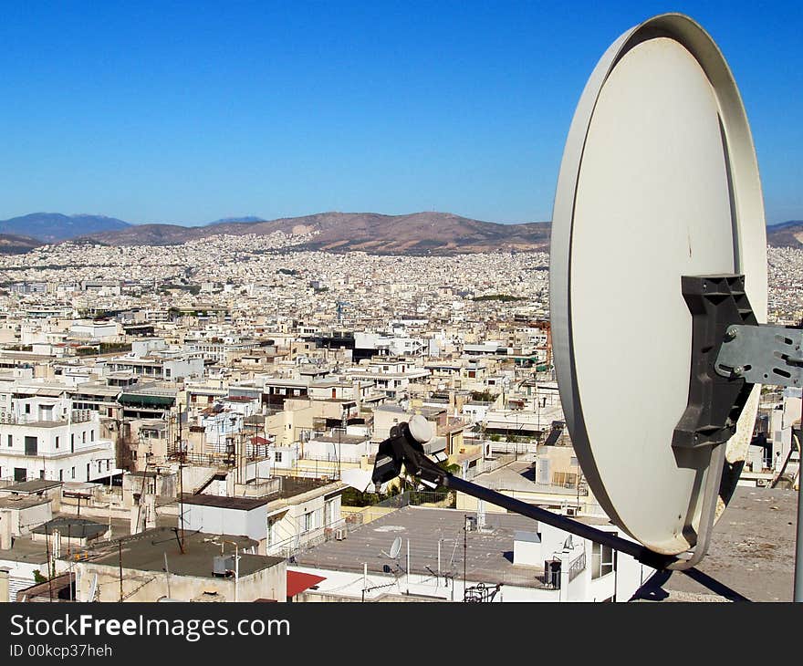 Satellite dish against city landscape. Satellite dish against city landscape