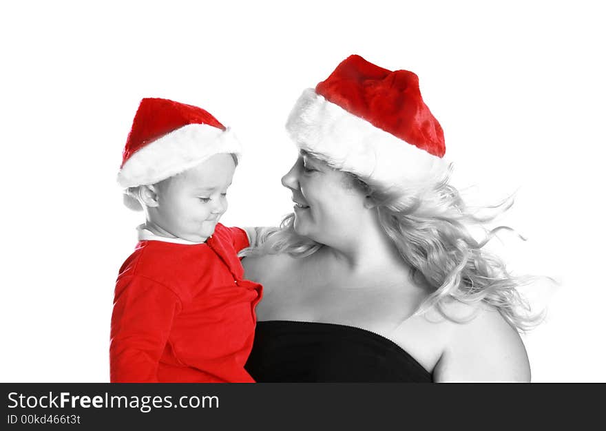 Mother and son getting ready for christmas day. Wearing their red santa hats. Mother and son getting ready for christmas day. Wearing their red santa hats.