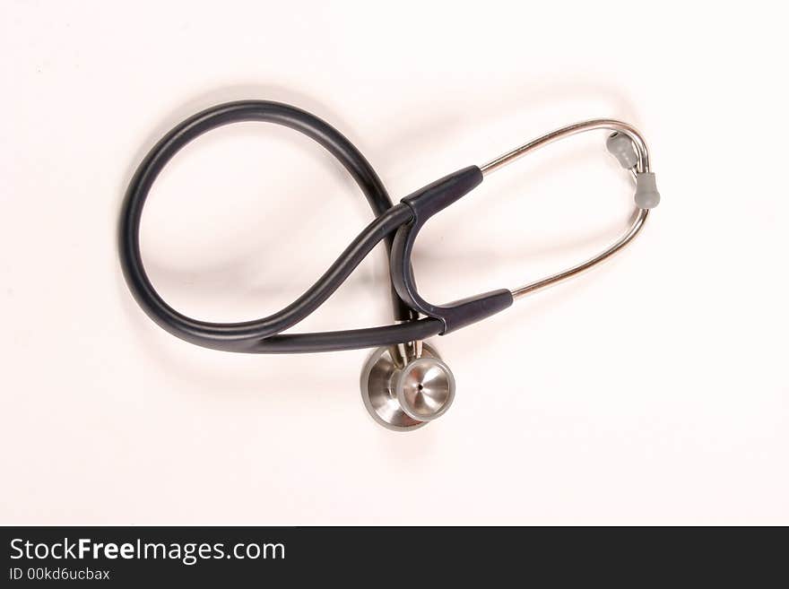 Stethoscope laying on a white background