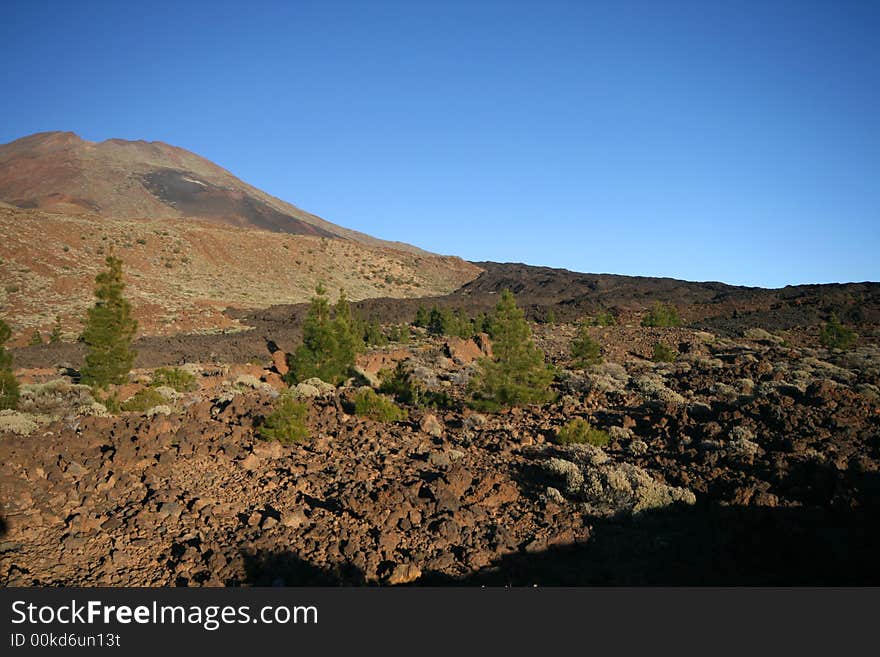 Black lava river down from a volcano