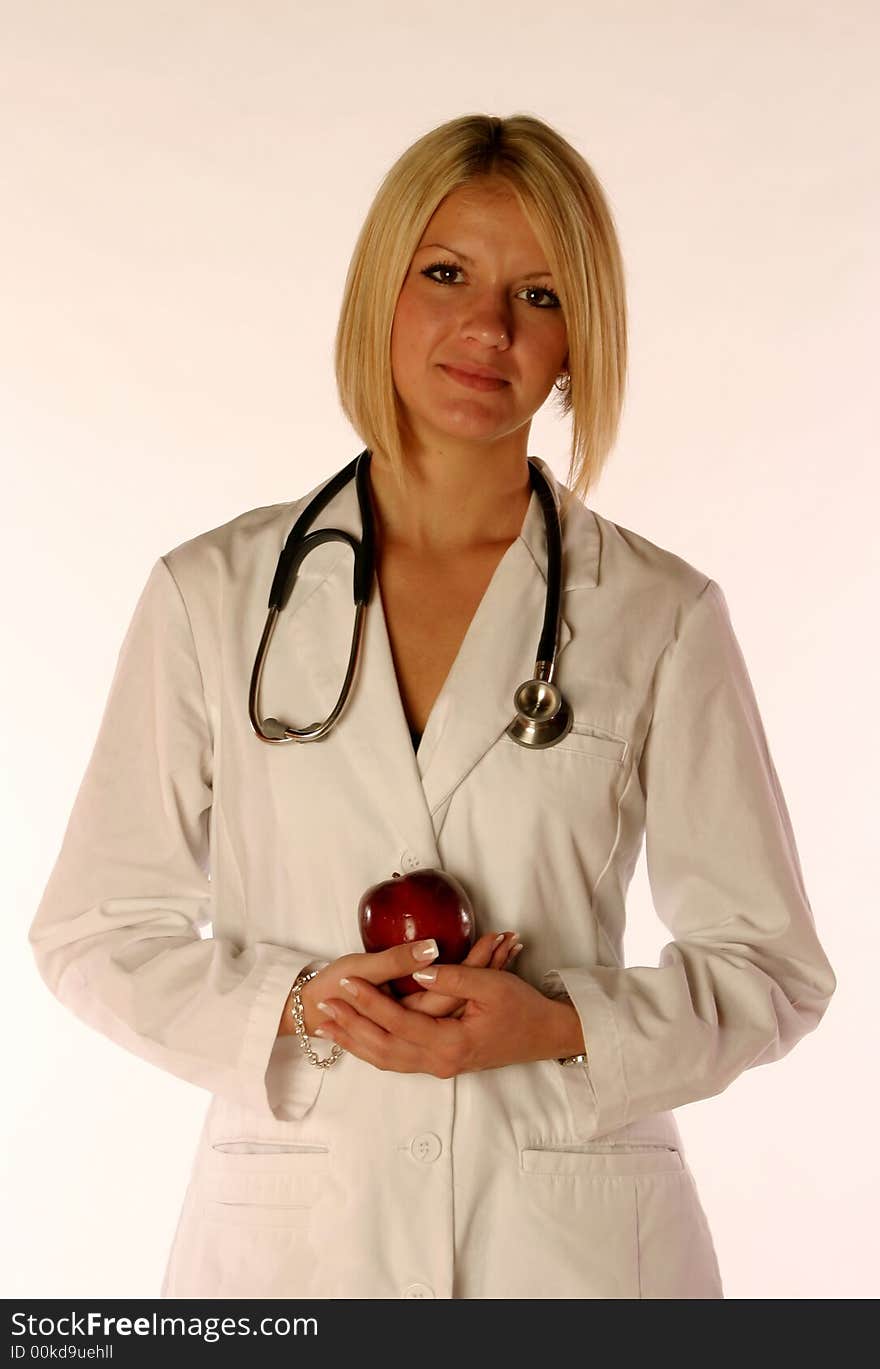 Female doctor holding an apple