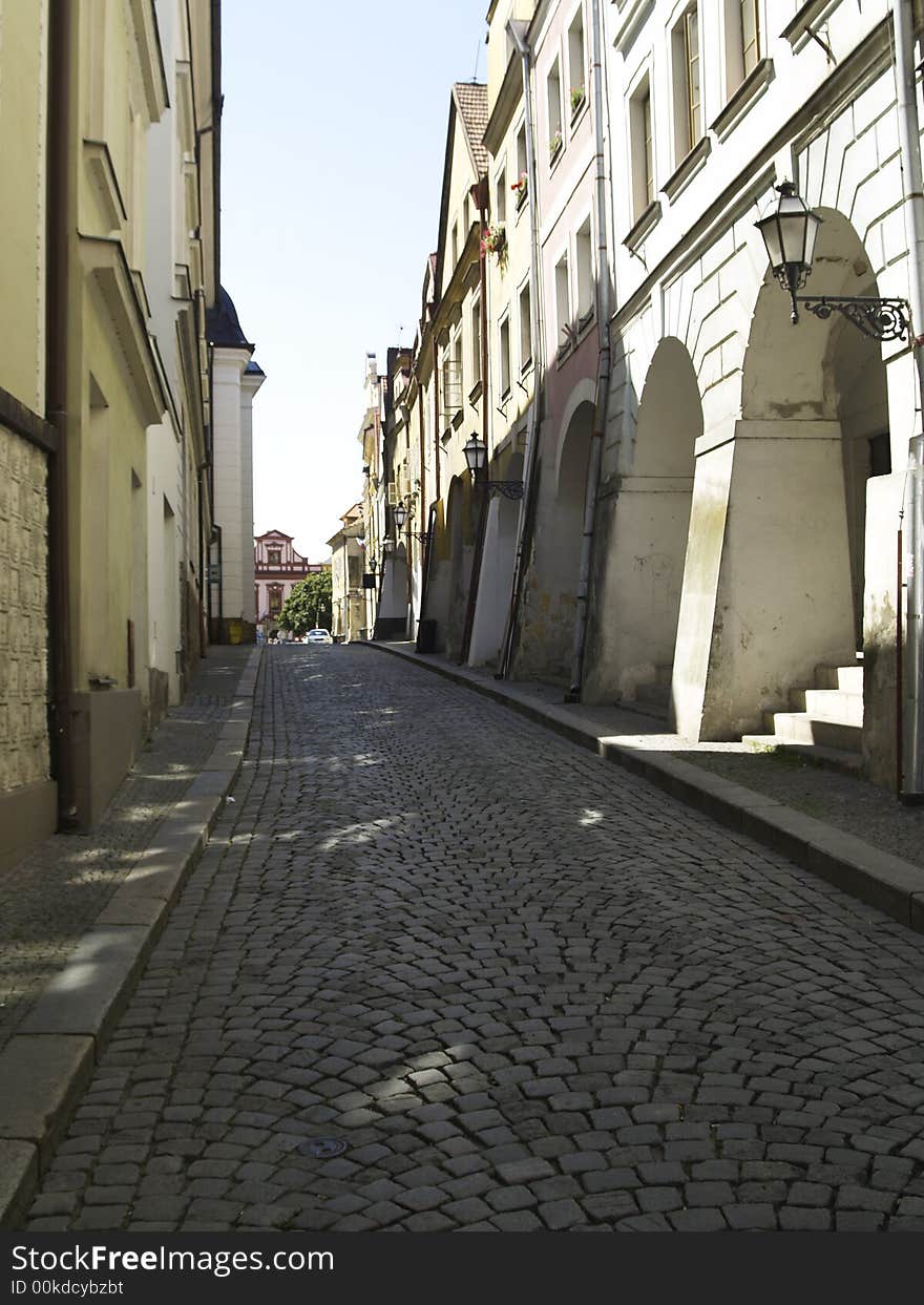 Old sett street in old town. Hradec in Czech Republic.