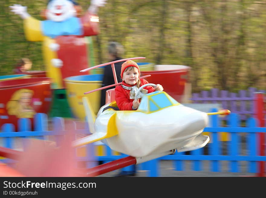 The girl is turned on a roundabout