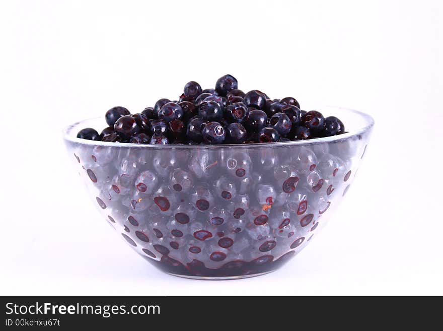 Blueberry close up isolated on white in glass. Blueberry close up isolated on white in glass