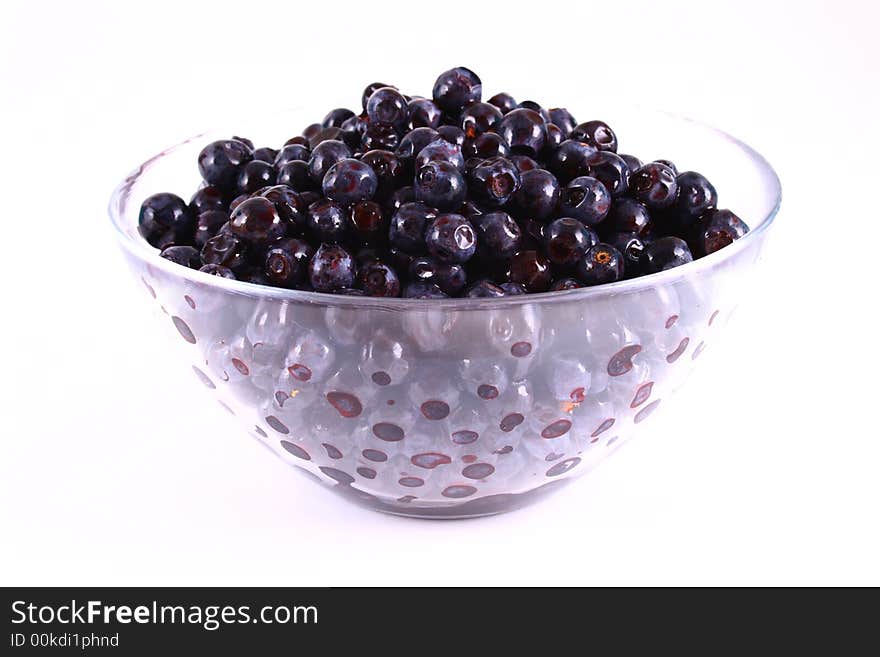 Blueberry close up isolated on white in glass. Blueberry close up isolated on white in glass