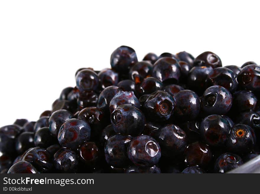 Blueberry close up isolated on white in glass. Blueberry close up isolated on white in glass