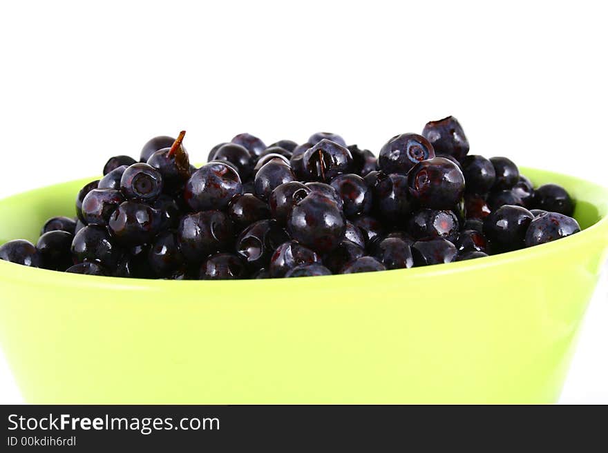 Blueberry close up isolated on white in glass. Blueberry close up isolated on white in glass