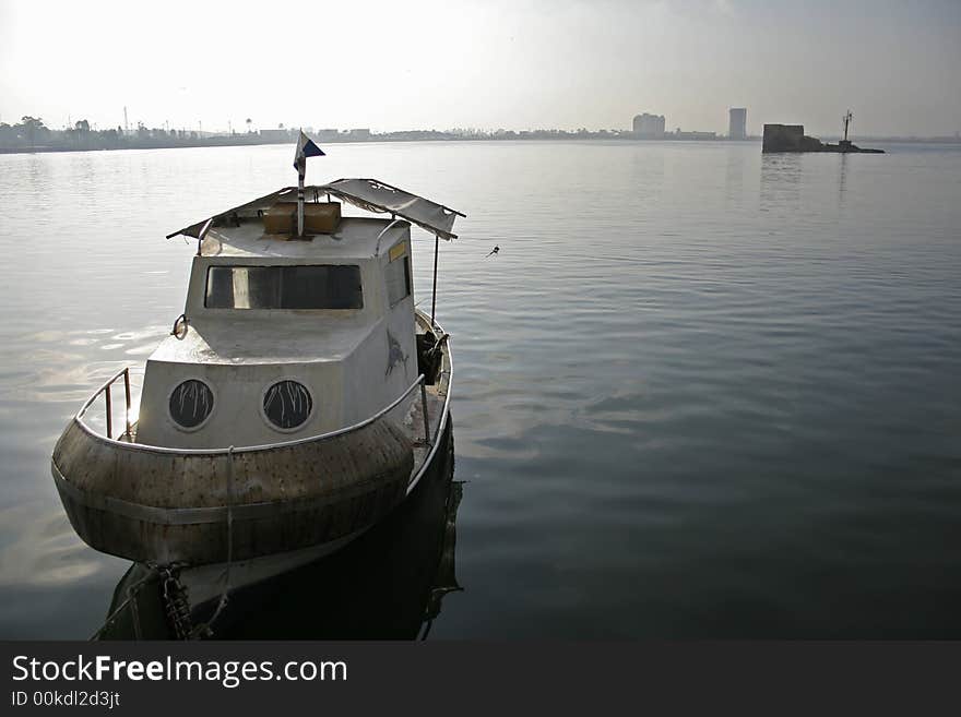 Small fishing boat anchor at sea