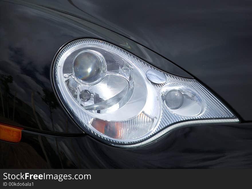 Headlight on a sports car. Headlight on a sports car