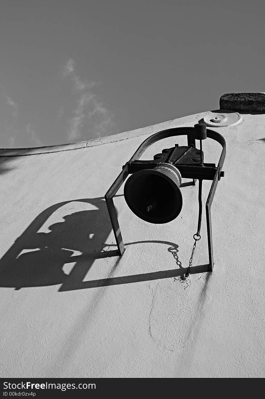 The old bell on the wall